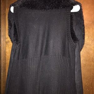 Black fur and sweater vest